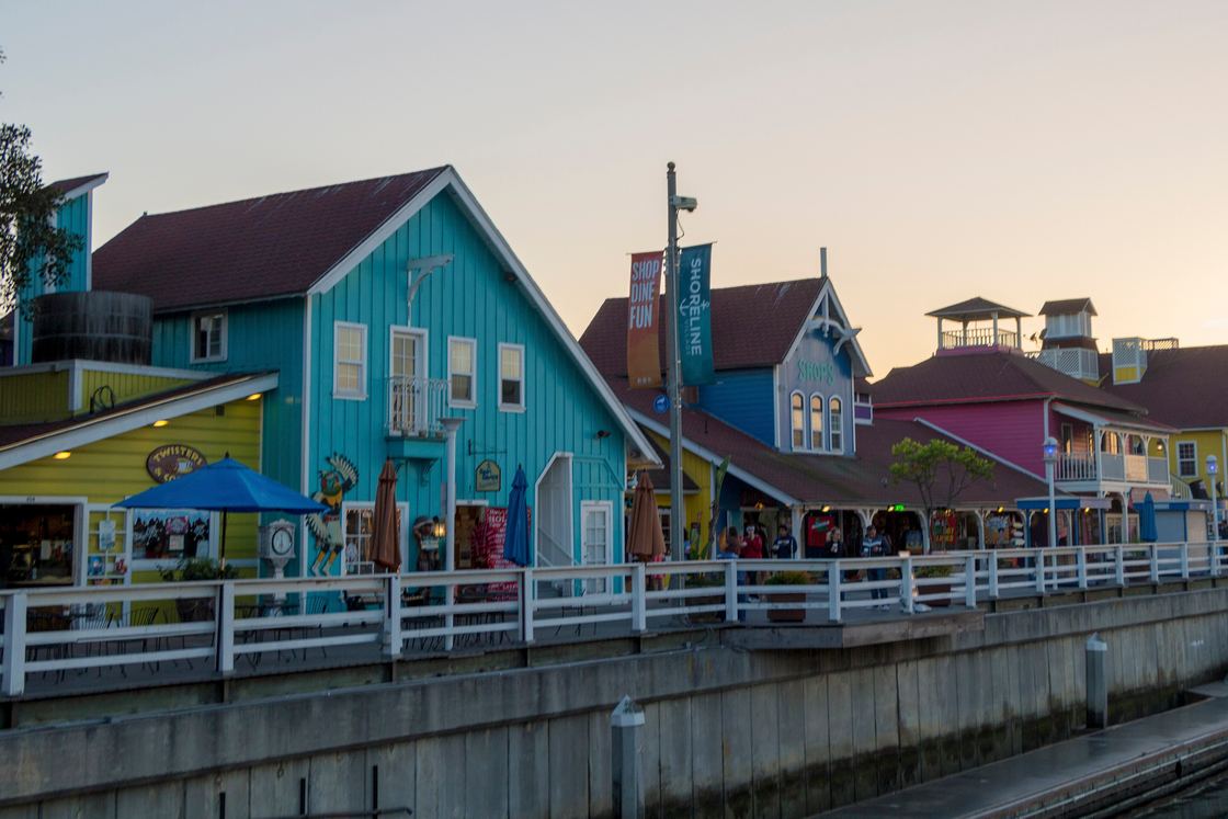 Brightly painted shops along the Shoreline Village boardwalk